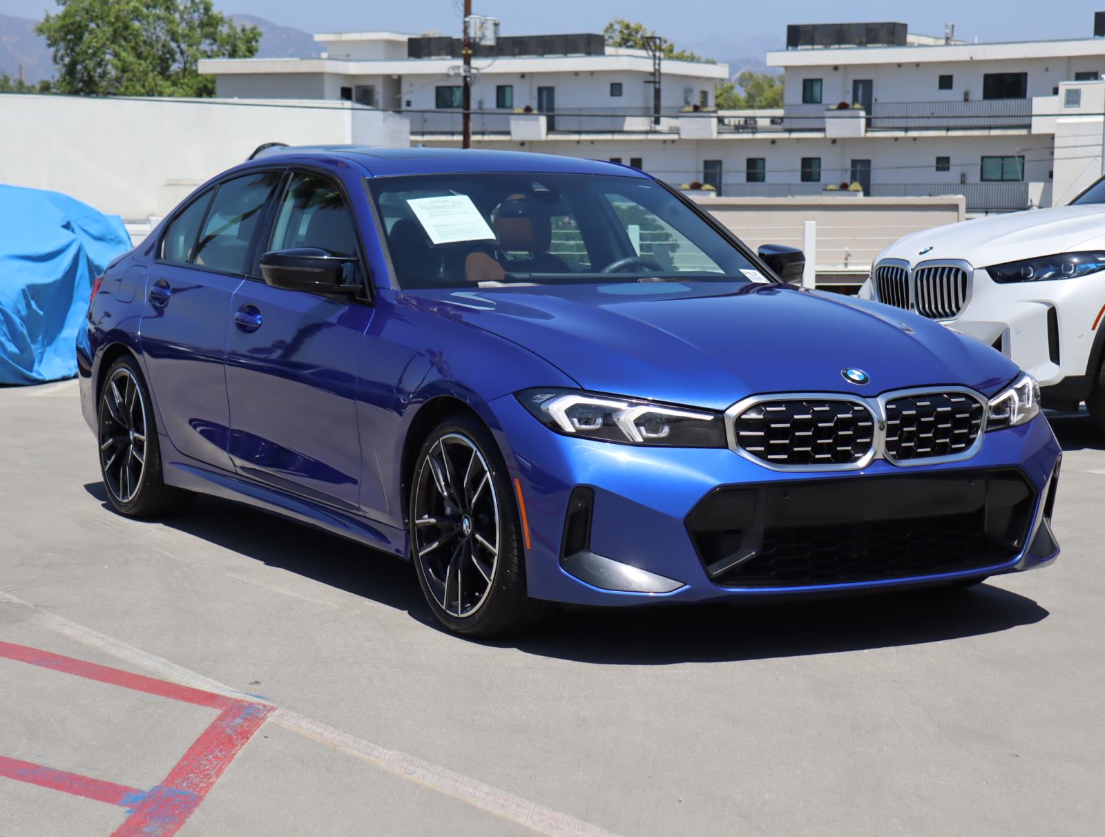 Used 2024 Portimao Blue Metallic BMW M340i Sedan image 1